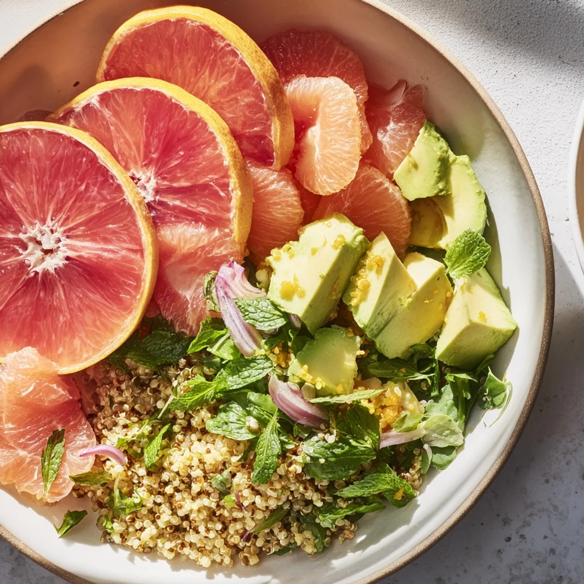 This photo features a vibrant Fresh Citrus & Avocado Quinoa Bowl, a vegetarian delight that’s visually appealing.