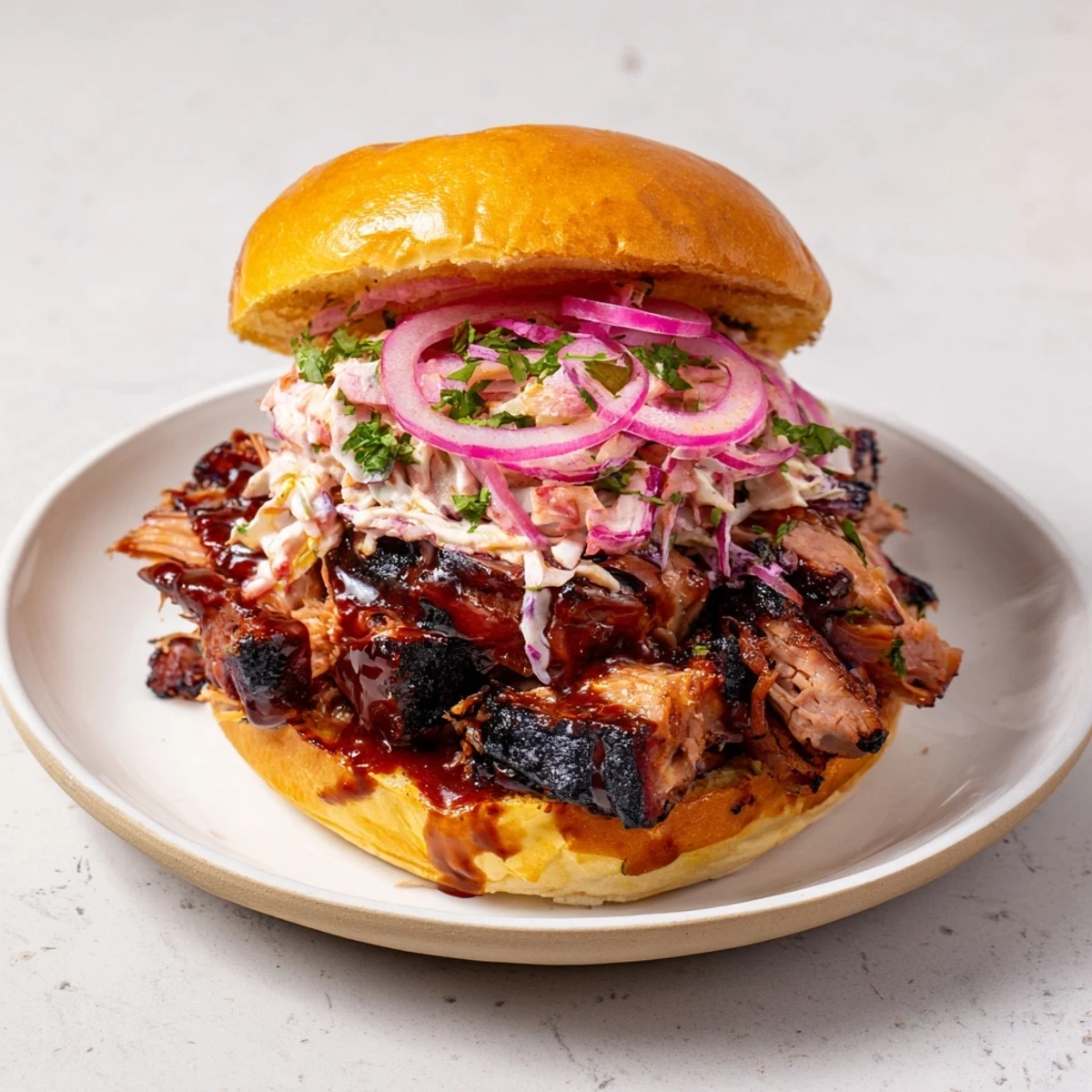 Fire-Kissed BBQ Pulled Pork Sandwiches: Tender, smoky pulled pork piled high on toasted buns, ready to enjoy.