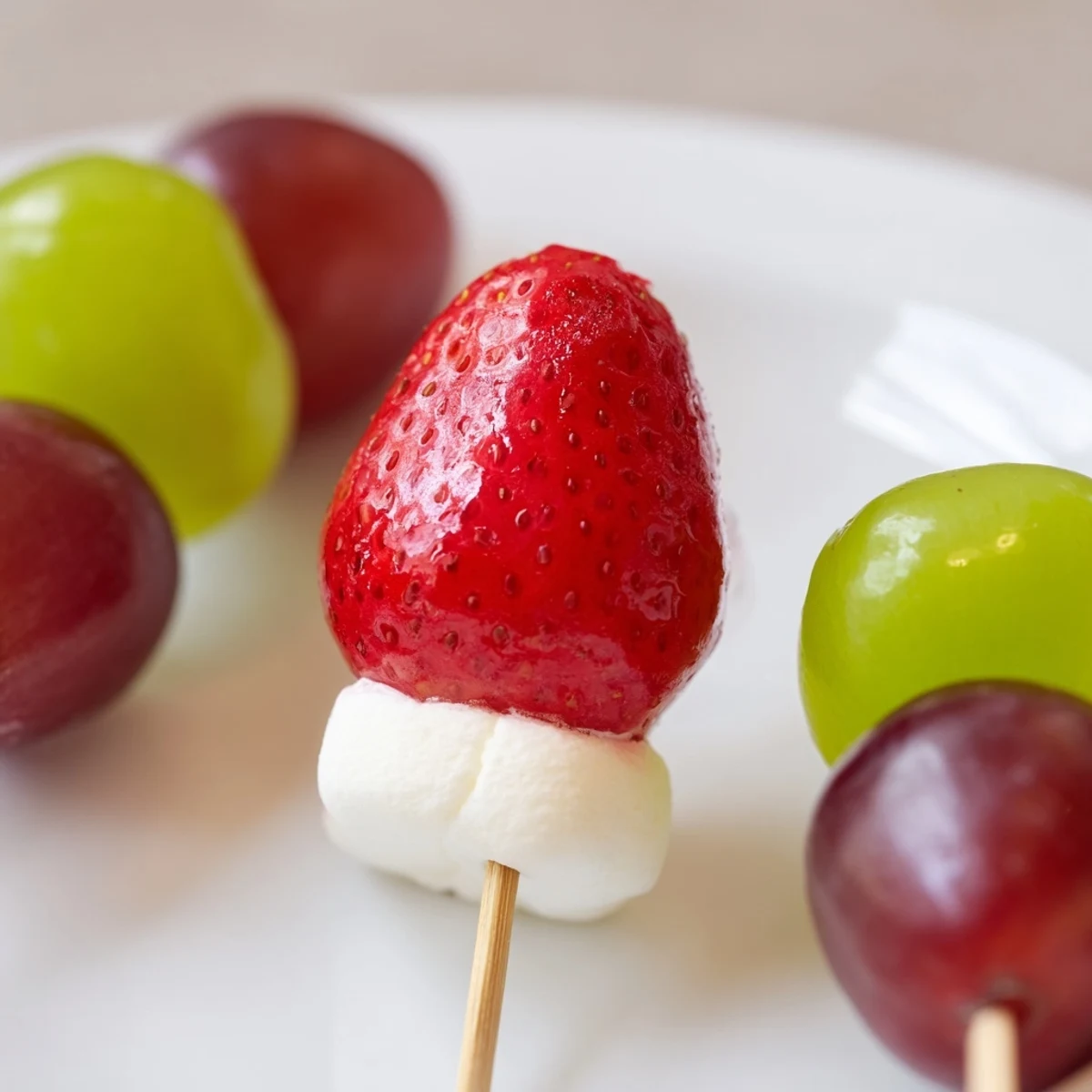 Bright and colorful Christmas Light Fruit Skewers offer a refreshing, healthy appetizer for the holidays.
