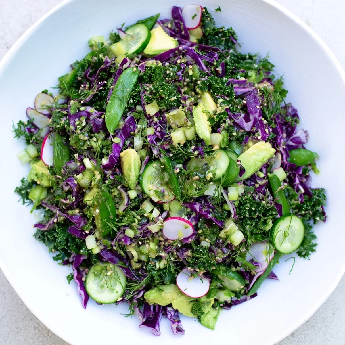 Vibrant Green Goddess Detox Cabbage Salad with crisp veggies and a tangy, zesty lemon dressing.