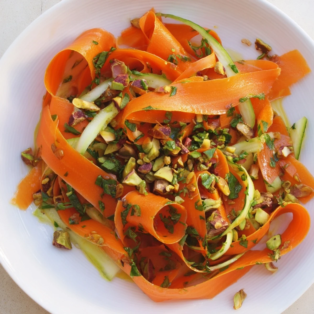 A lovely light Citrus Carrot Ribbon Salad, drizzled with honey, perfect as a side dish.