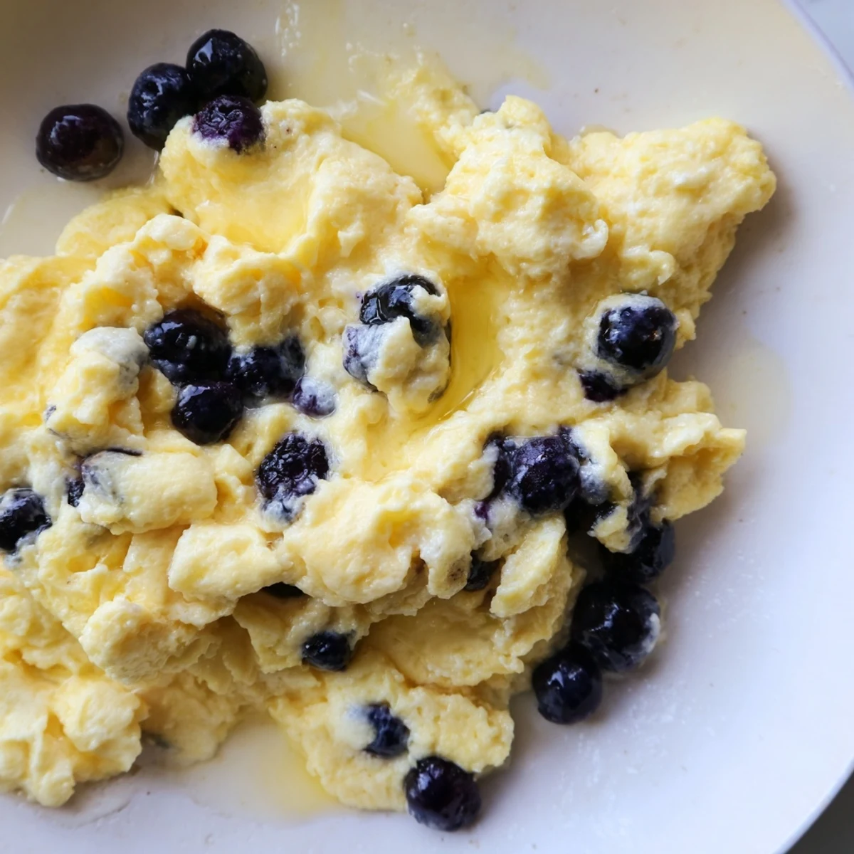 Soft, pillowy fluffy scrambled pancakes with blueberries, perfect for a quick and easy breakfast.