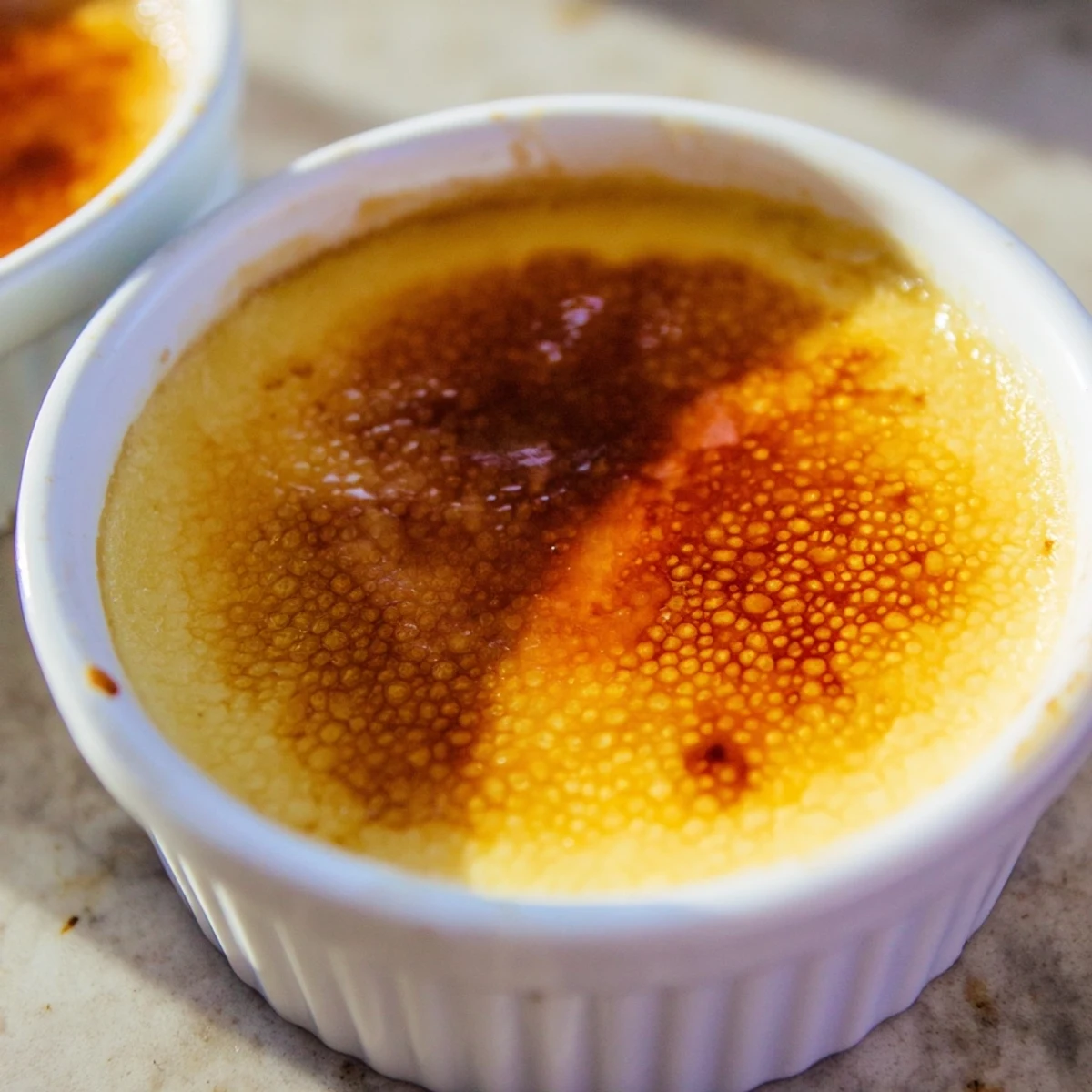 Golden-brown, decadent 3-Ingredient Crème Brûlée, offering a satisfying crackle and creamy custard.