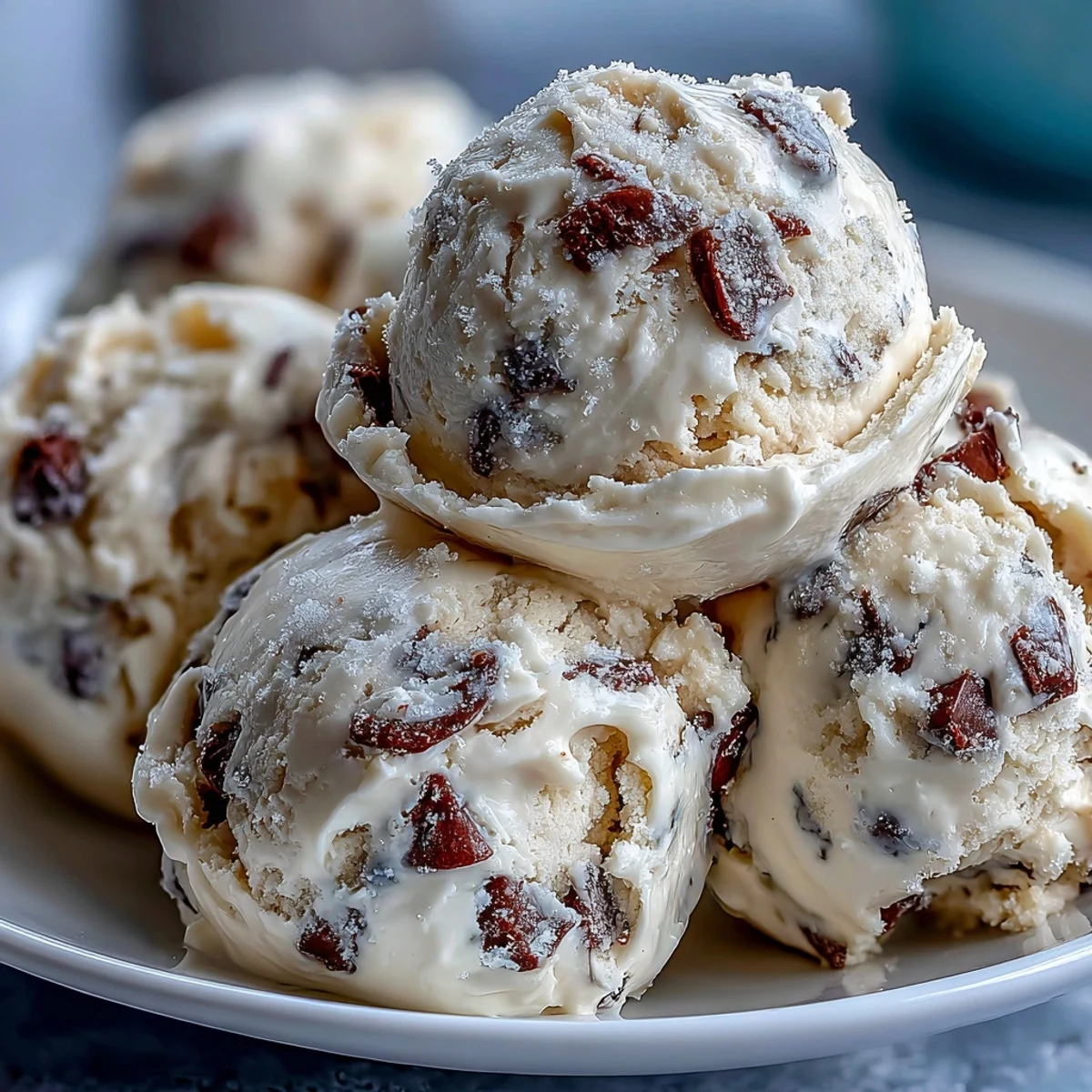 Buttery Greek Yogurt Cookie Dough is folded with melty chocolate chips and served chilled.
