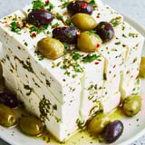 This Turkish Olives & Cheese Board features creamy feta, briny olives, drizzled honey, and crusty warm pita.