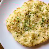 Puffy Cloud Bread Savory Toast with garlic and Parmesan, ready to be dipped into a bowl of creamy tomato soup.