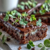 Lucky Clover St. Patrick's Day Cookie Bars with chocolate chips and green sprinkles in a 9x13-inch pan, baked to golden perfection and cut into 16 festive squares.