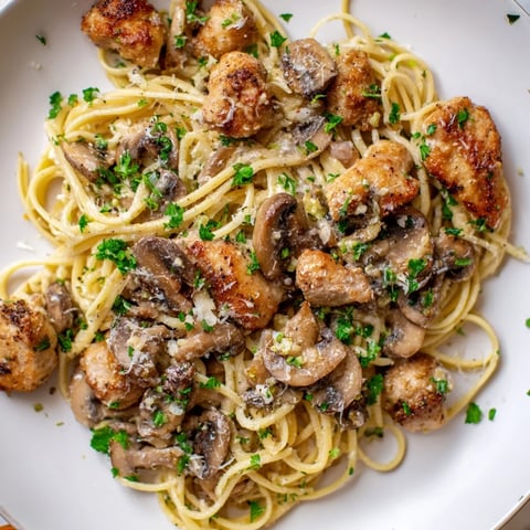 Creamy Mushroom Chicken Pasta: a comforting plate of pasta swirled in a rich, creamy sauce.