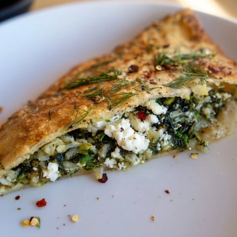 Golden-brown Turkish Spinach & Feta Flatbread, filled with a savory spinach and feta mixture.