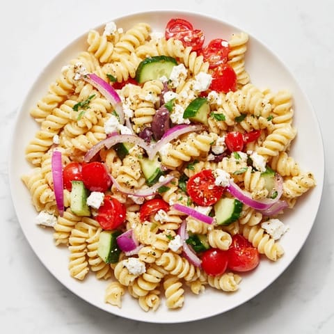 This chilled Mediterranean Olive Oil and Feta Pasta Salad features crumbled feta and Kalamata olives.