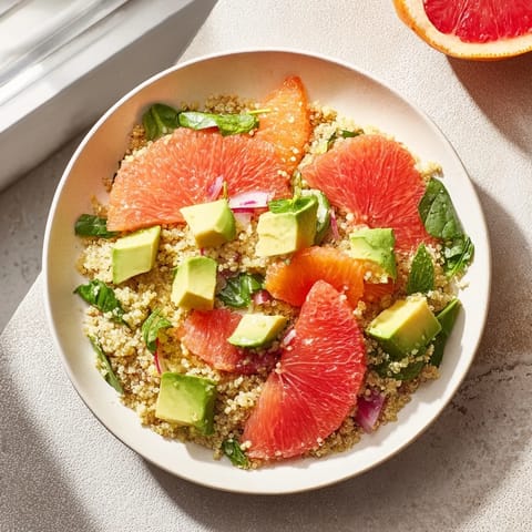 Enjoy this Fresh Citrus & Avocado Quinoa Bowl, a healthy meal bursting with fresh flavors and textures.