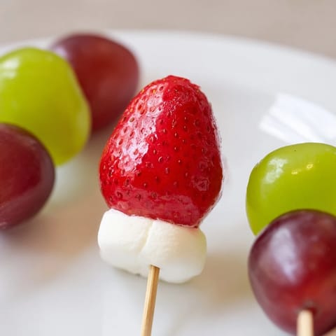 Bright and colorful Christmas Light Fruit Skewers offer a refreshing, healthy appetizer for the holidays.