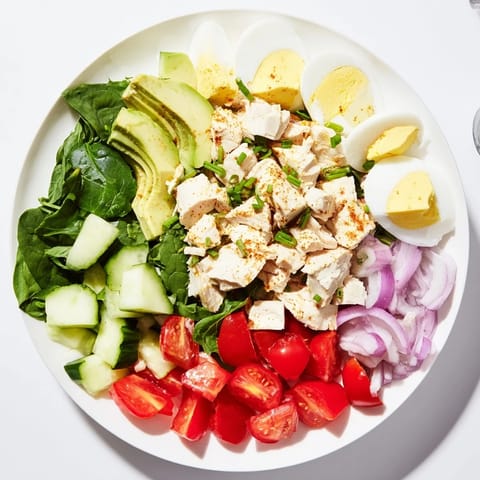 This High-Protein Chicken and Egg Salad features juicy chicken, fresh veggies and tangy dressing.