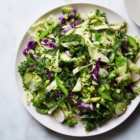 Freshly tossed Green Goddess Detox Cabbage Salad, brimming with colorful vegetables, ready to serve.