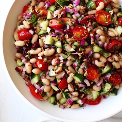 Freshly tossed Dense Bean Salad with Sleepy Girl flavors, ready for a healthy meal.