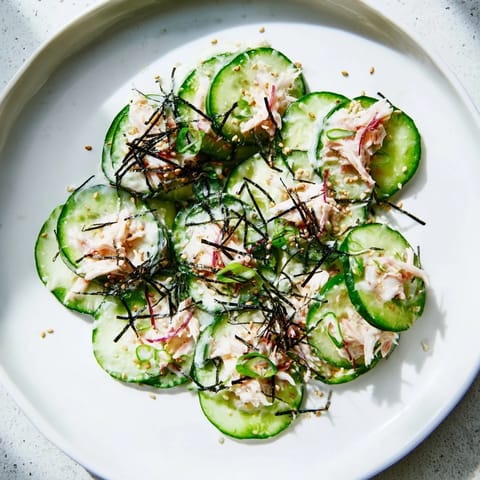 Sliced cucumbers and shredded imitation crab tossed in tangy mayo dressing, garnished with nori strips and toasted sesame seeds.