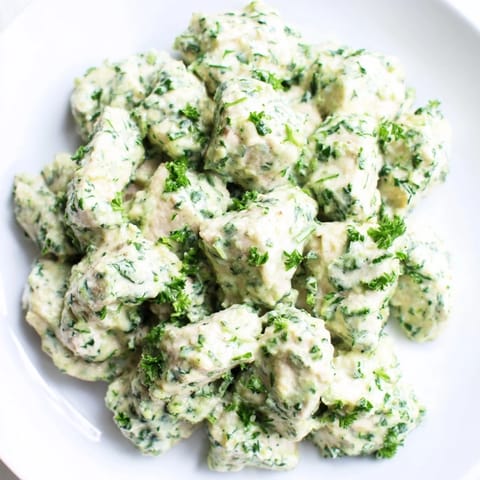 Colorful salad features cherry tomatoes, cucumber, and avocado slices for added freshness.