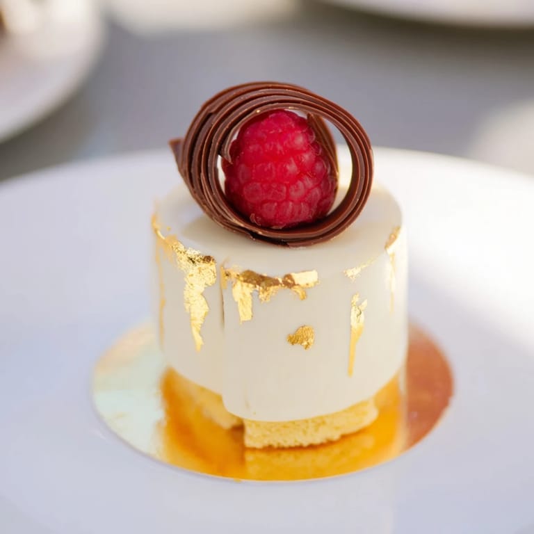A golden dust covers this beautiful The Golden Ratio Shell dessert, perfect for any special occasion.