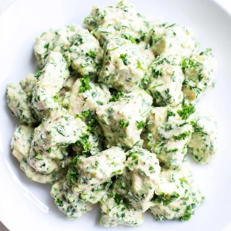 Colorful salad features cherry tomatoes, cucumber, and avocado slices for added freshness.