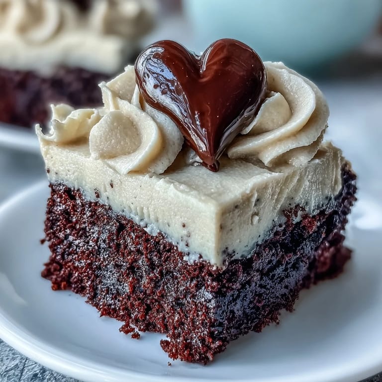 A slice of Red Betty Boop Heart Cake reveals a moist red crumb and rich chocolate.