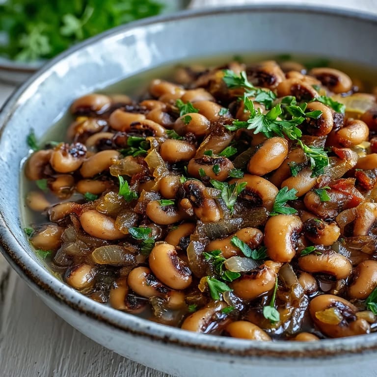 Frozen Black-Eyed Peas Quick Version simmered with onions and garlic, served Southern-style with a bay leaf.